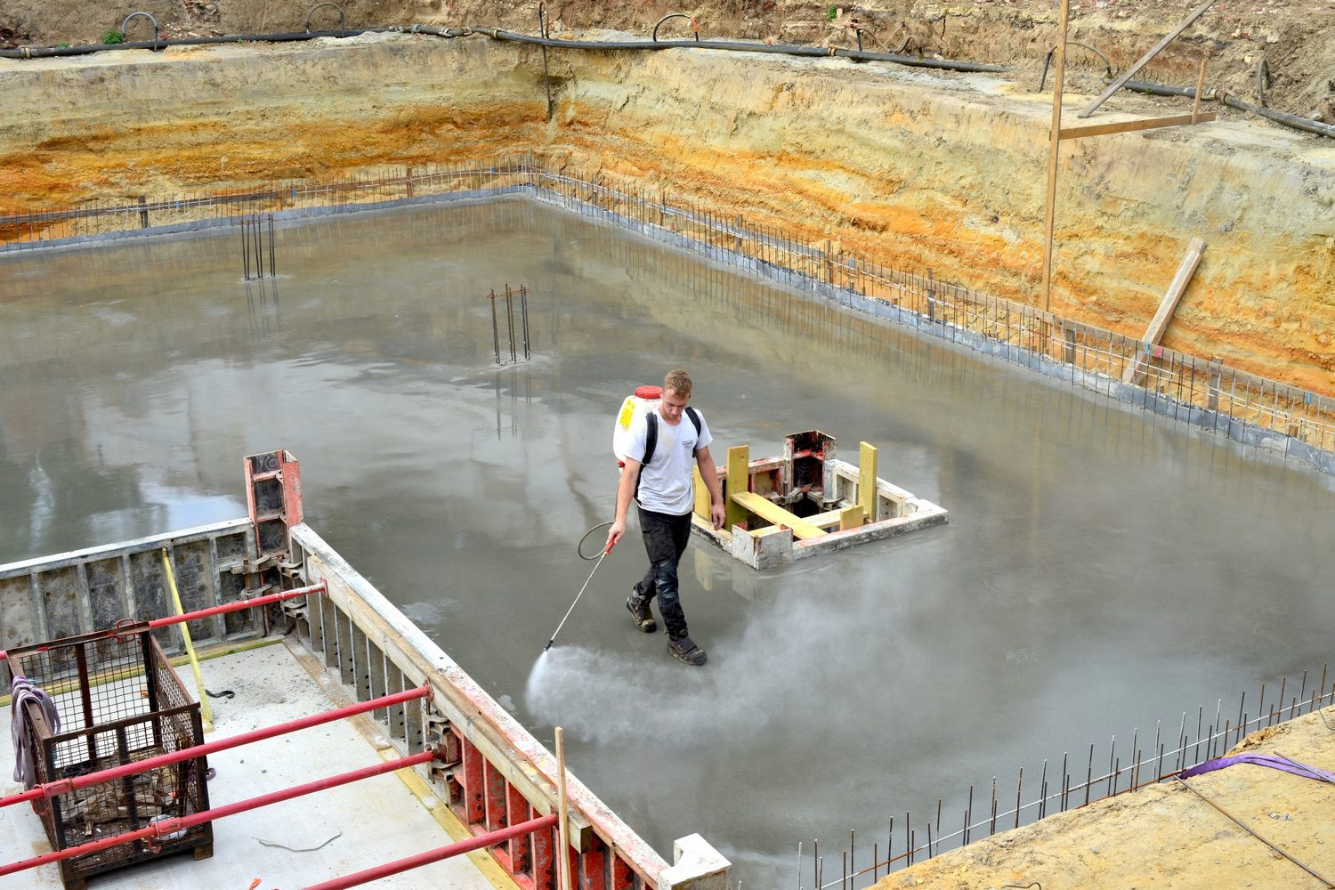 Spraying construction surface
